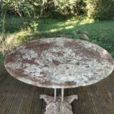 Old cast iron art-deco garden table