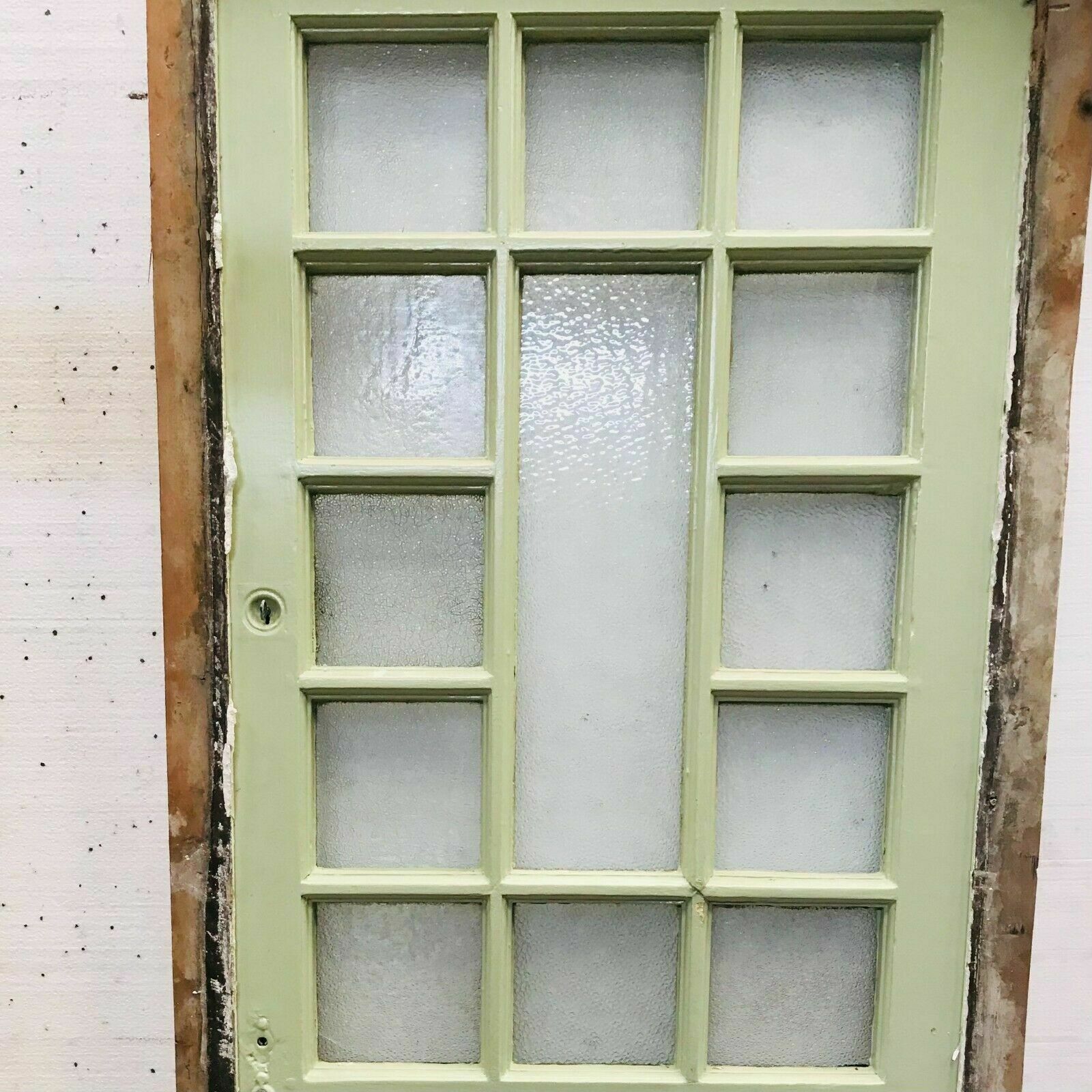 Porte de service à petits carreaux et imposte vitrée XX siècle