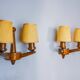 Pair of two-armed art deco "ball" wall lights, carved wood, France, 1960