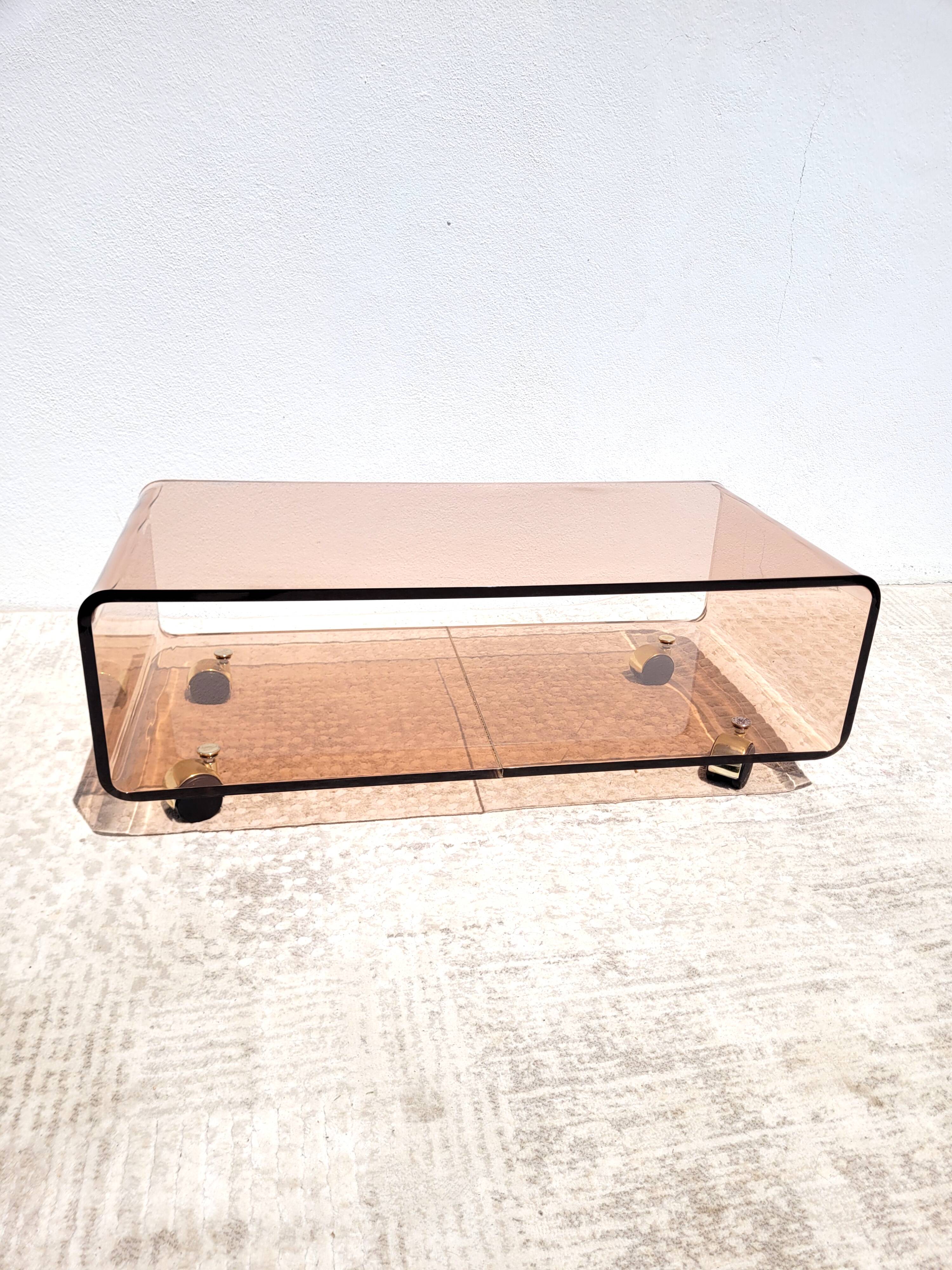 Vintage plexiglass coffee table with wheels 1970