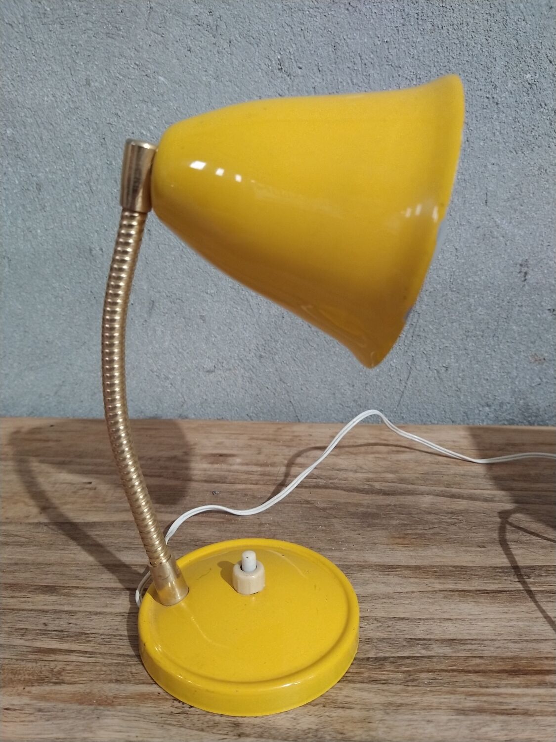 Yellow articulated desk lamp in metal