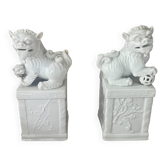 Pair of dragon dog bookends in white porcelain from Dehua.