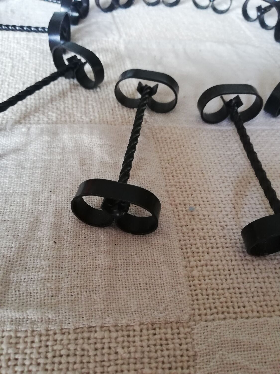 Set of 12 black twisted wrought iron knife holders from the 50s