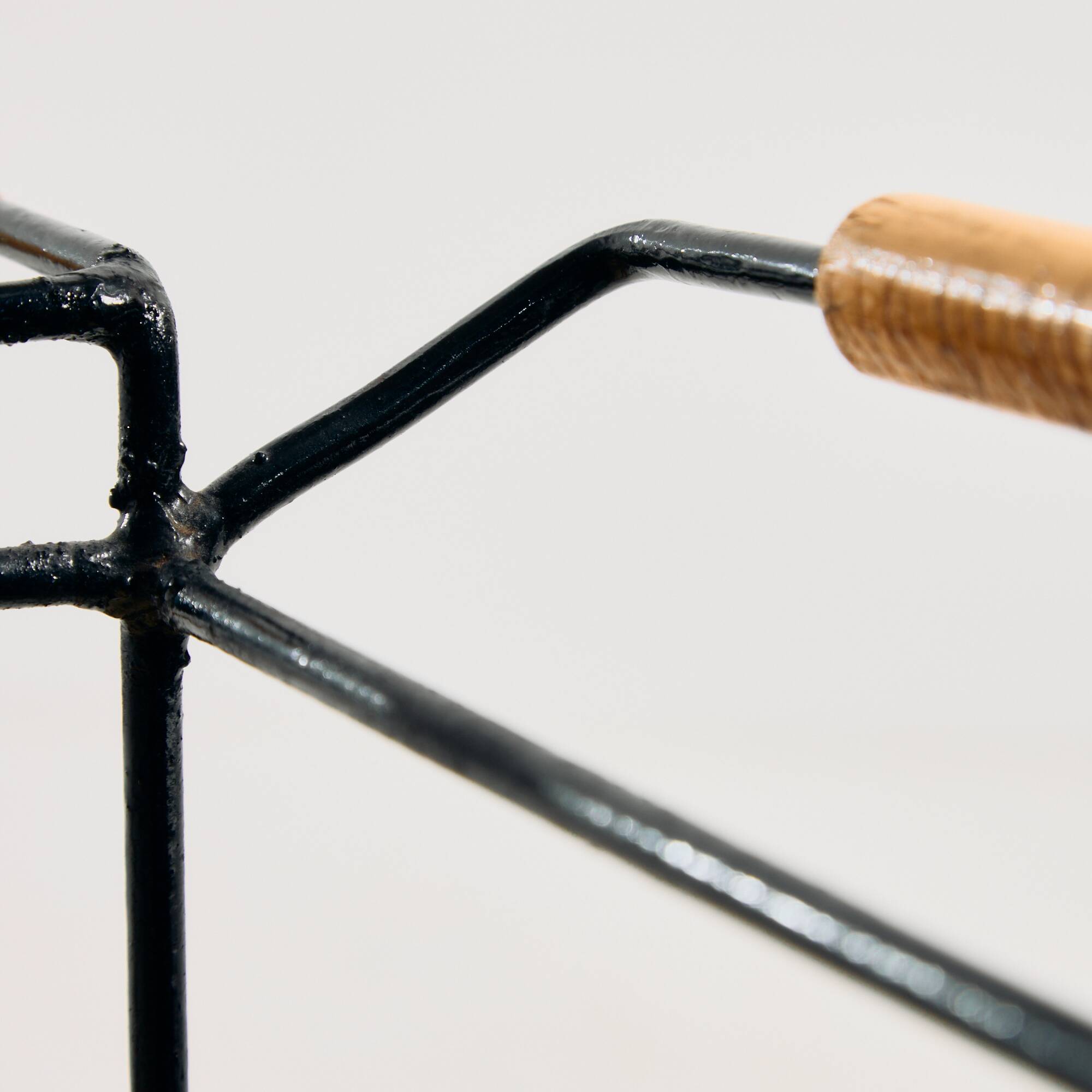 Metal cart with bamboo and wicker details.