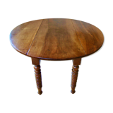 Mid-19th-century walnut round table with shutters, flaps