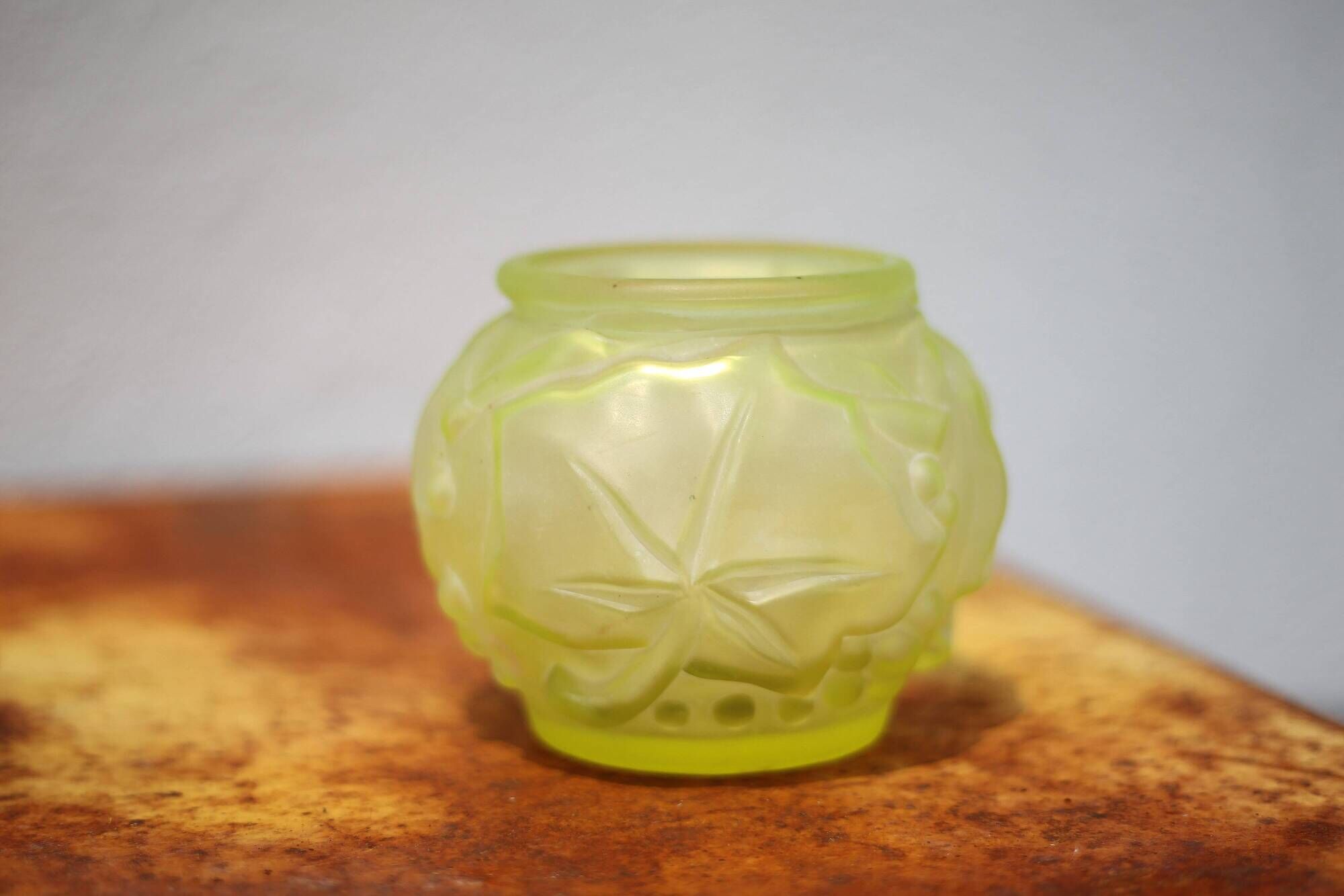 Fluorescent yellow ball vase with vine leaf patterns