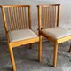 Set of 4 Scandinavian dining chairs in light wood.