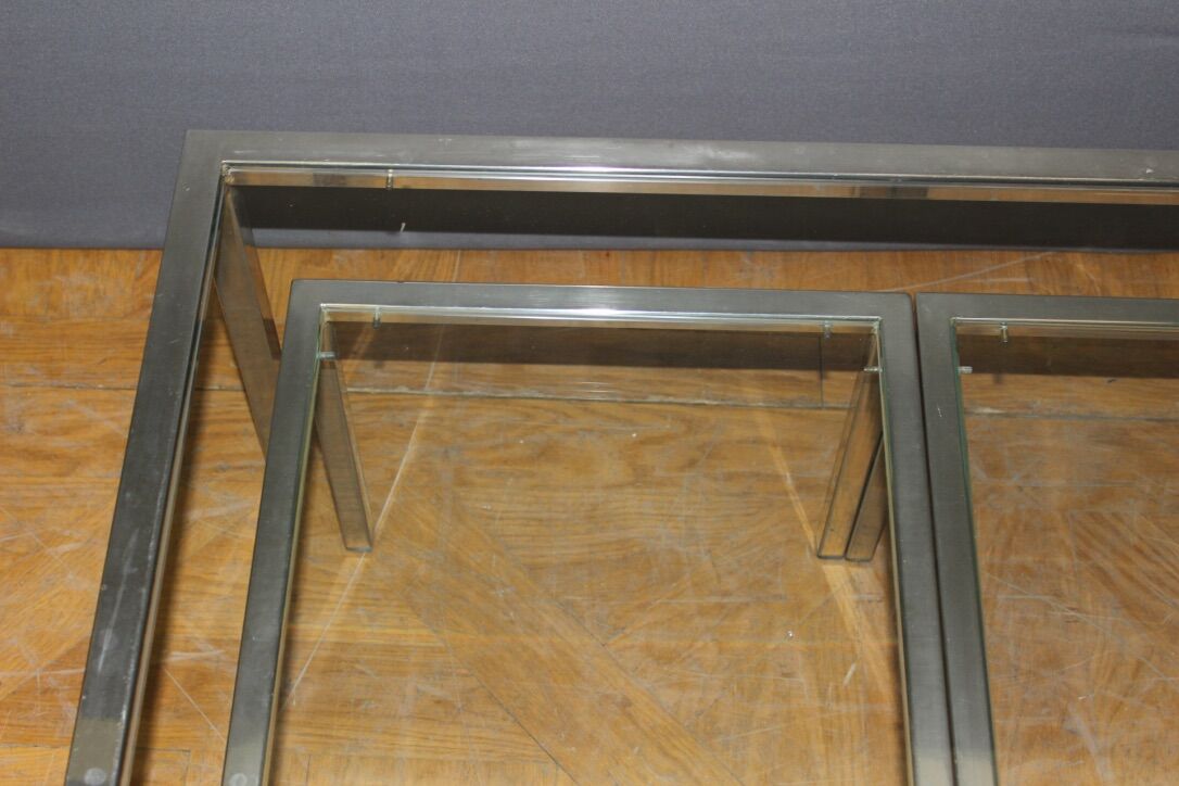 Coffee table and its steel and glass wiggles around 1970
