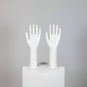 Pair of authentic vintage jewellery displays in industrial porcelain representing hands.