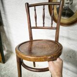 Antique children's chair in curved wood