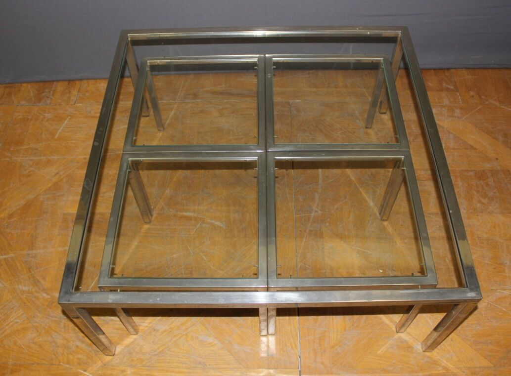 Coffee table and its steel and glass wiggles around 1970