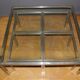 Coffee table and its steel and glass wiggles around 1970