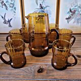 Orangeade set with pitcher and 6 amber glass glasses with "woven" fabric surround