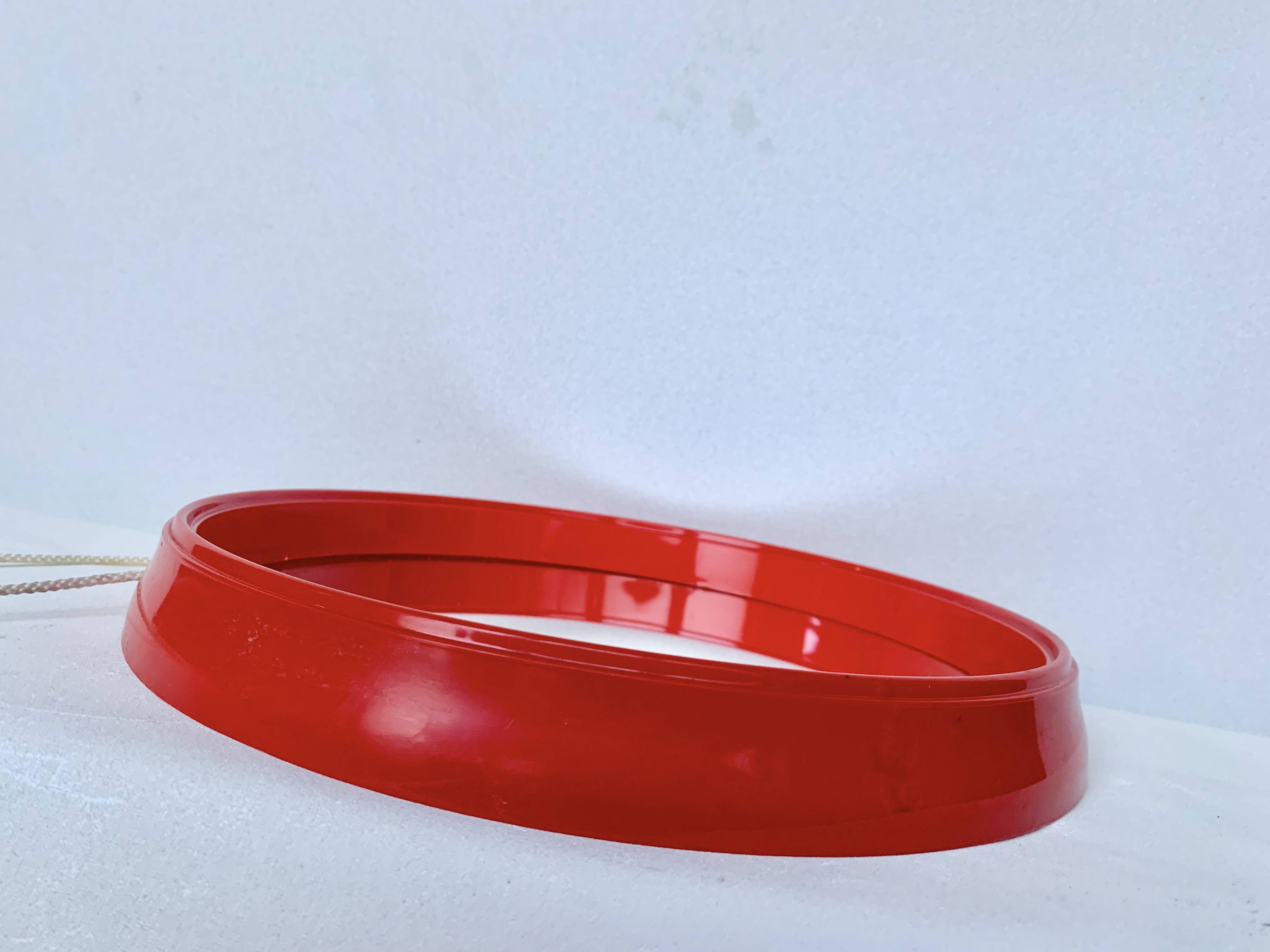 Pair of vintage round red plastic mirrors