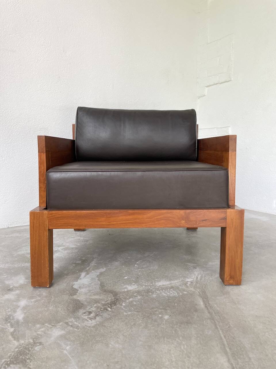 Modernist armchair in exotic wood and leather