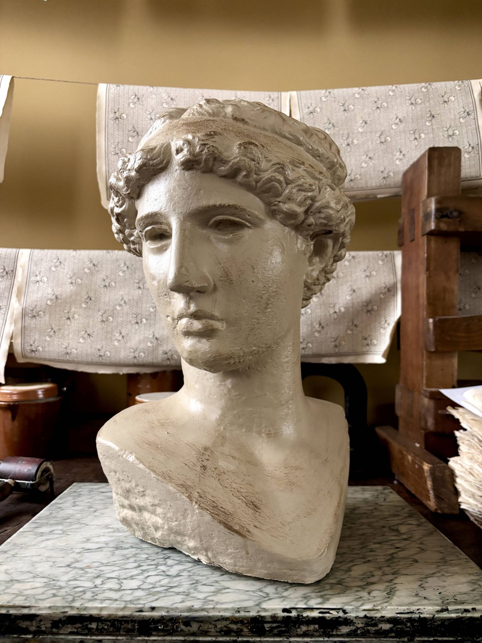 Concrete bust painted in beige - reproduction, detail of "The Dying Slave"