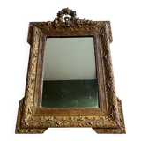 Golden trumeau mirror for fireplace, late 19th century, with sculpted pediment.