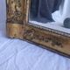 Antique Louis Philippe style gilded mirror decorated with floral motifs