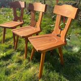 Three solid wood chairs