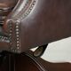 Brown cow leather Chesterfield office chair on wheels in English style
