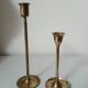 Set of two straight brass candlesticks.