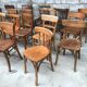 Set of 15 mismatched curved wood bistro chairs