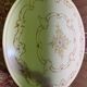 Louis XVI dining room table set with painted wood, gold accents, and pink velvet.