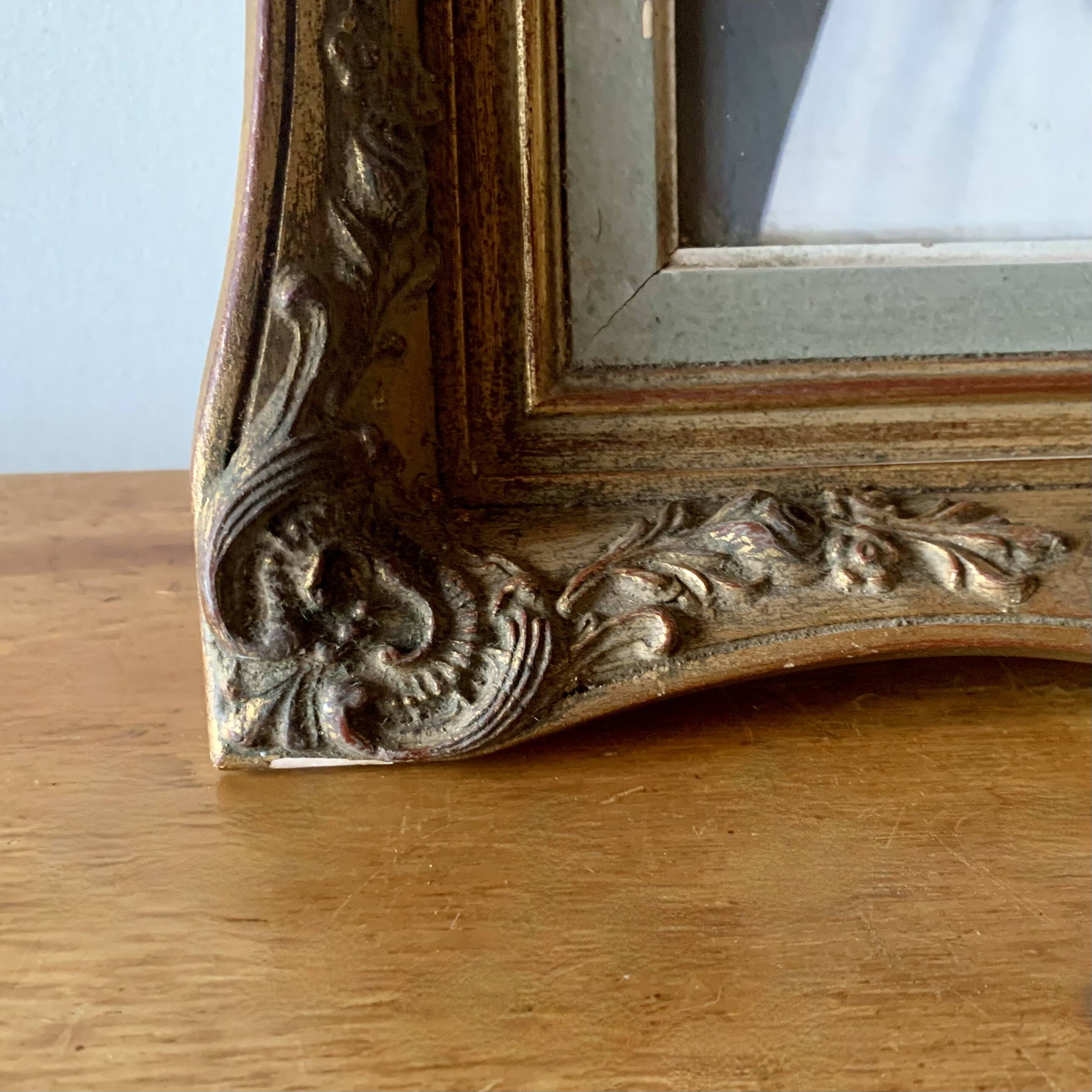 Old gilded carved wooden wall frame