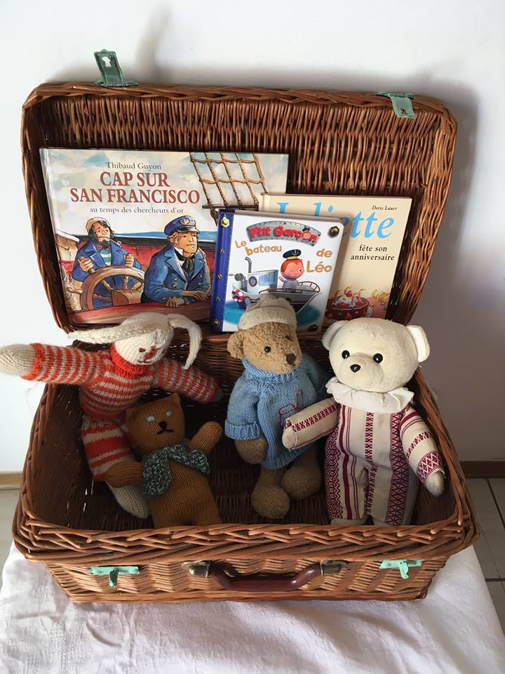 Wicker suitcase to store toys.