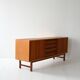 Vintage Scandinavian teak sideboard with metal-lined drawers