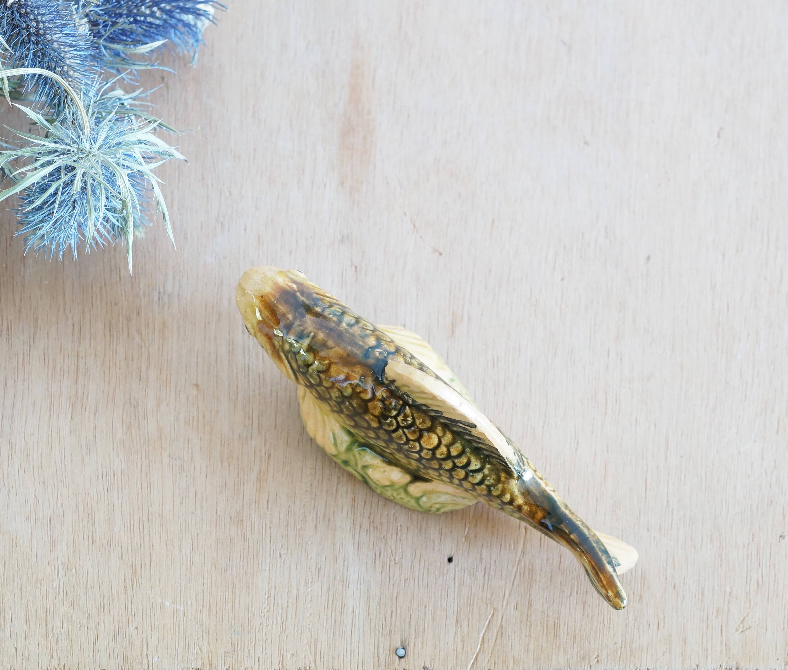 Small earthenware fish figurine