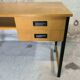 Vintage desk in modernist style made of wood.