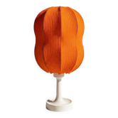 Lamp with a plastic base and a coloured fabric shade in Mid Century style.