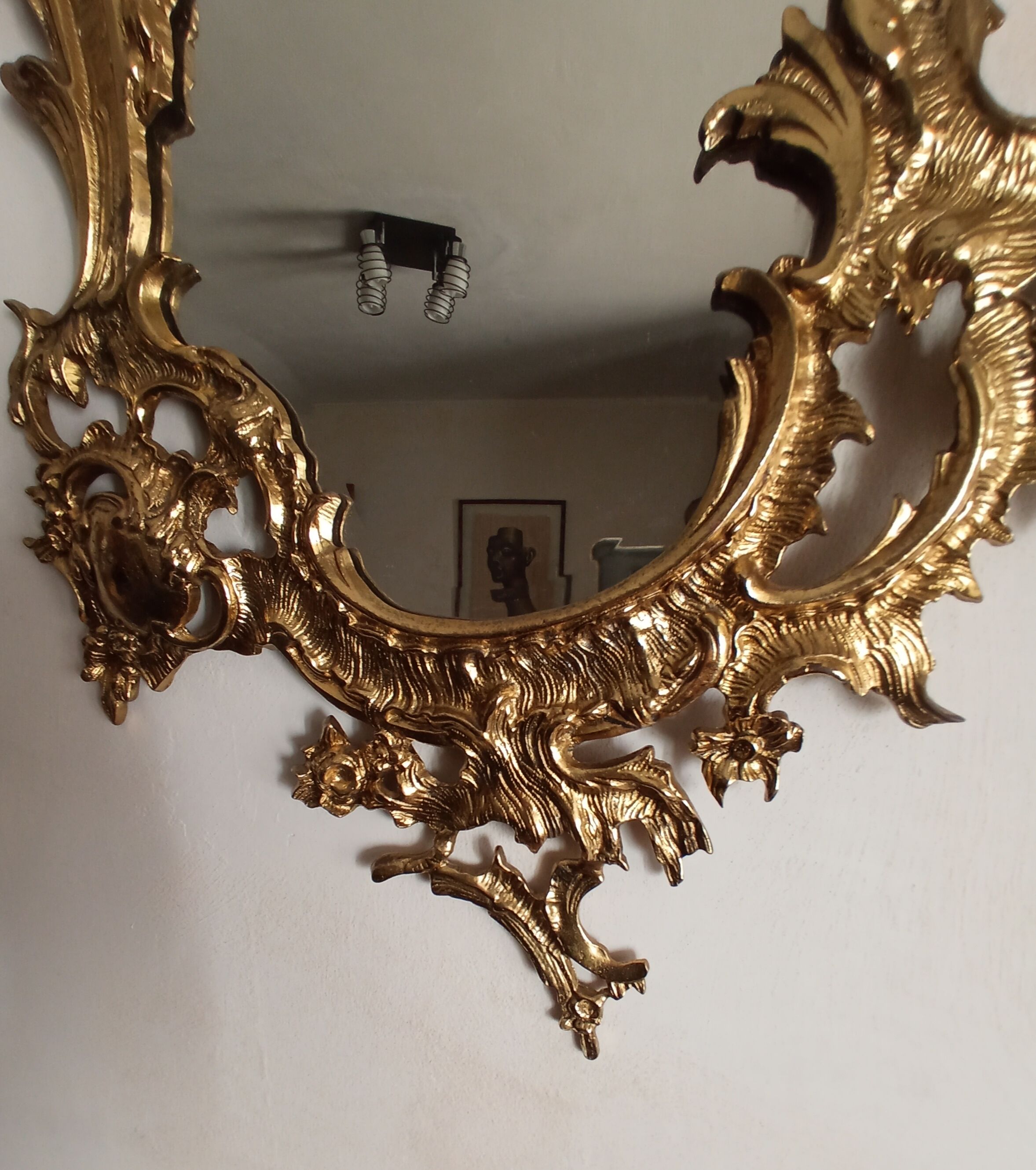 Antique mirror in gilded metal