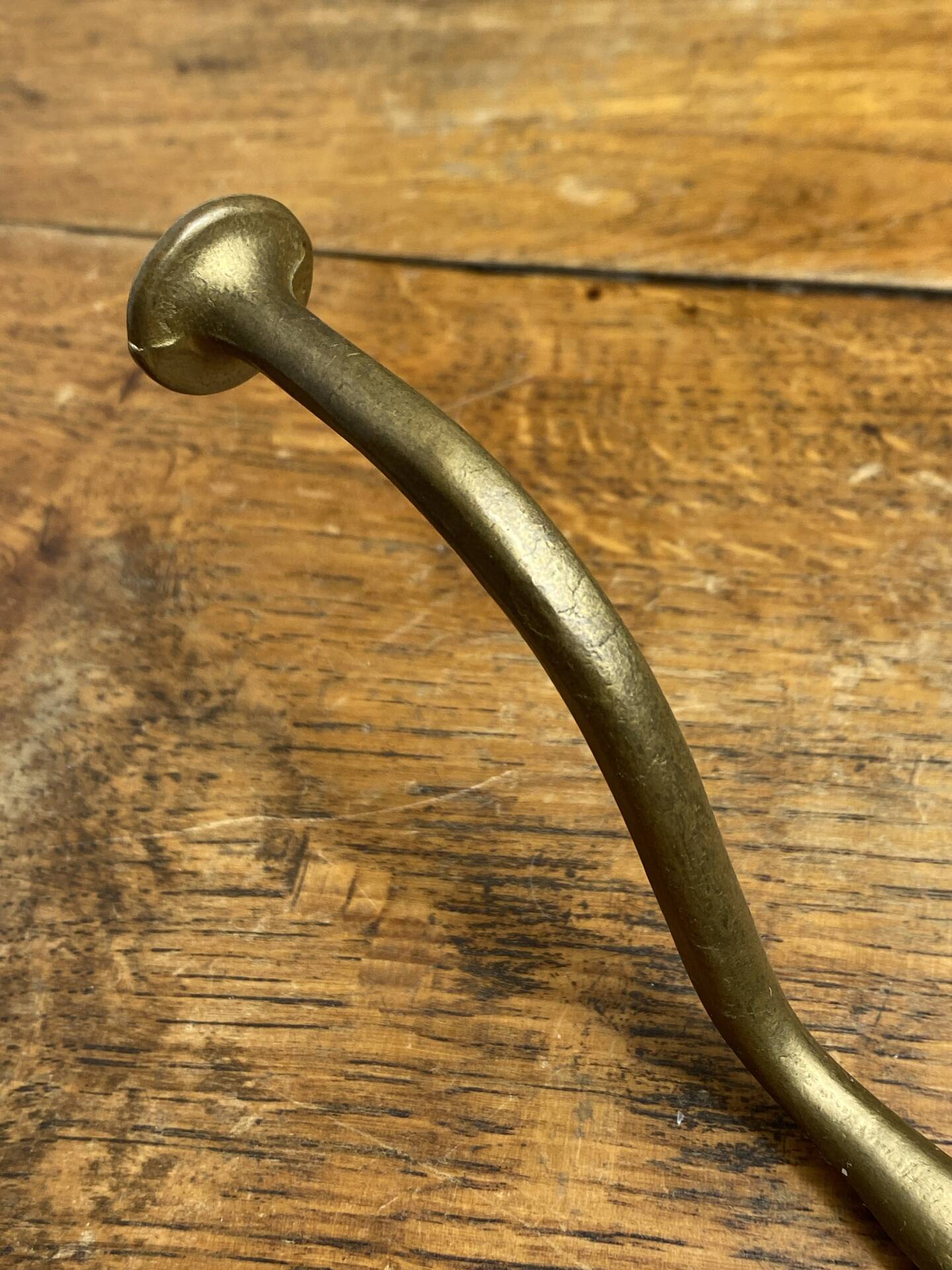 Wall-mounted brass hook