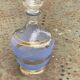 Blue granite glass carafe with vintage gold trim.