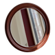 Round vintage mirror with mahogany wood effect frame.
