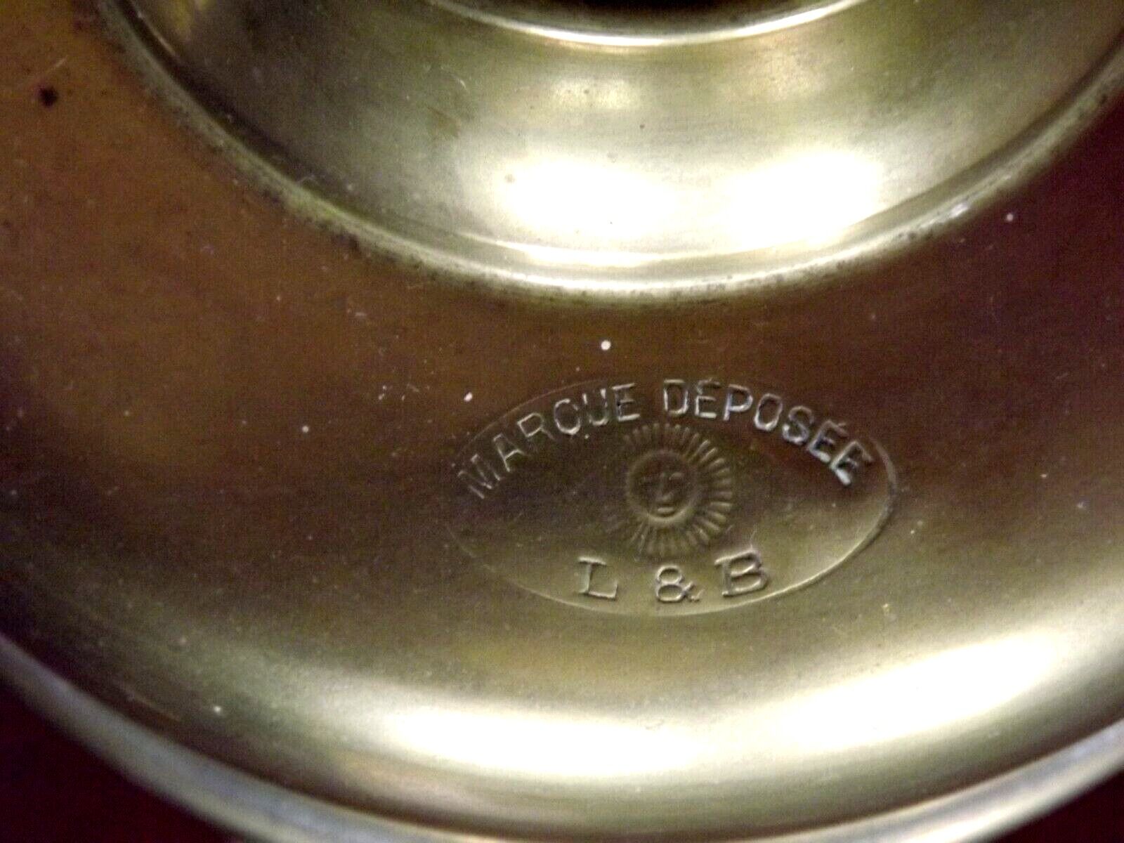 Vintage brass oil lantern with decorative base and transparent glass funnel stamped L B Brand Delay 4399.