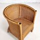 Pair of cabriolet armchairs in wicker and black edging