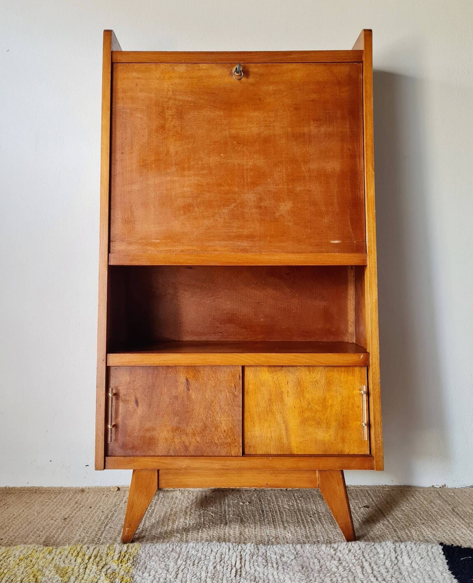 Vintage 1950s wooden secretary with tapered legs and mint interior.