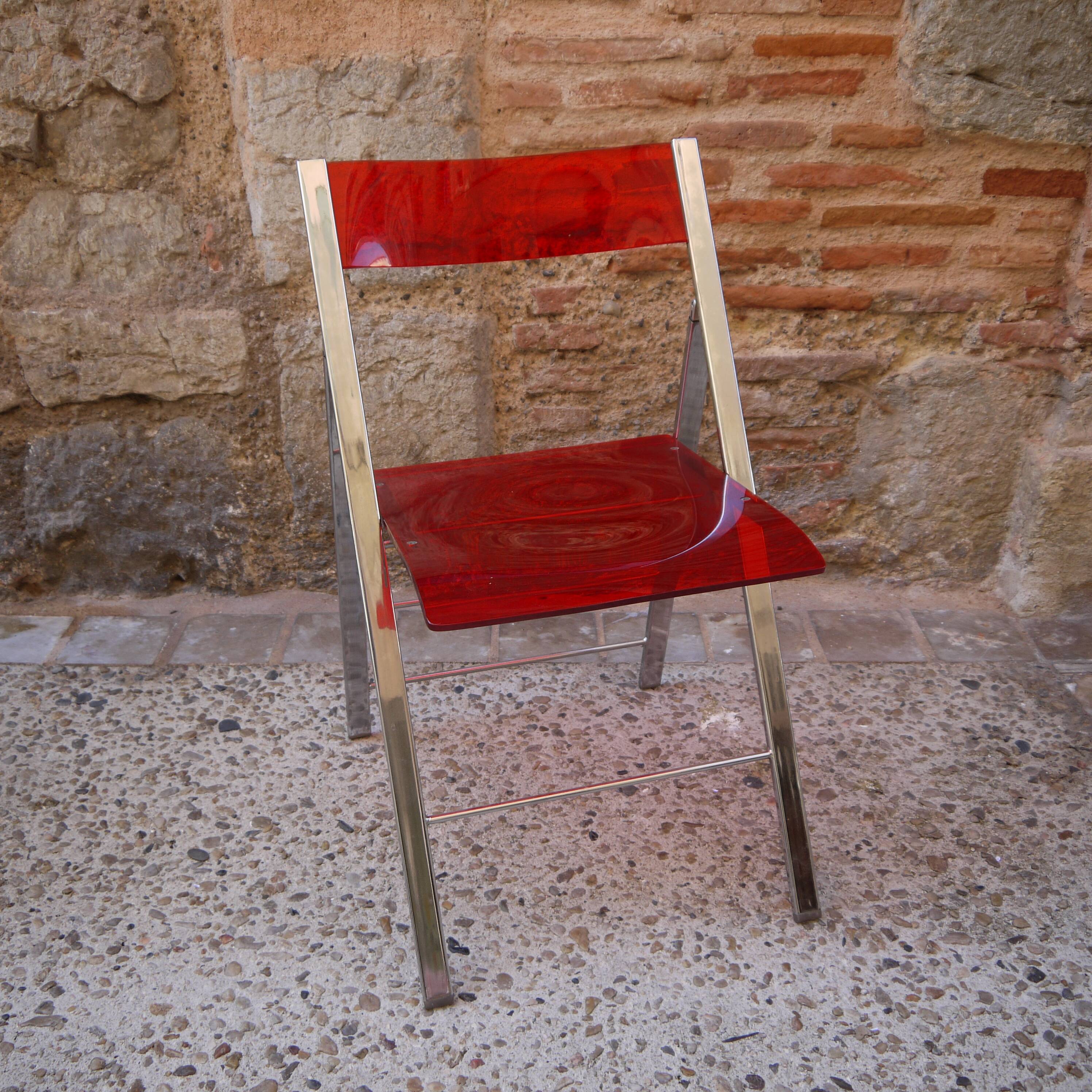 Red Plexiglas folding chair