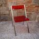 Red Plexiglas folding chair
