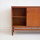 Buffet Ilmari Tapiovaara in teak with fabric and brass details.