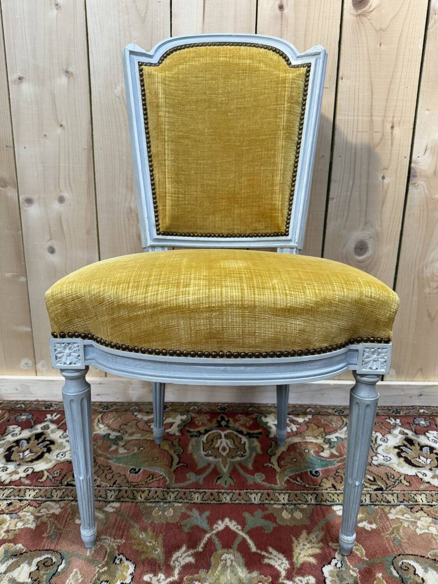 Set of 6 Louis XVI style chairs with polished wood and velvet.