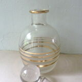 Pair of glass whiskey decanters with gold edging