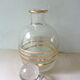 Pair of glass whiskey decanters with gold edging