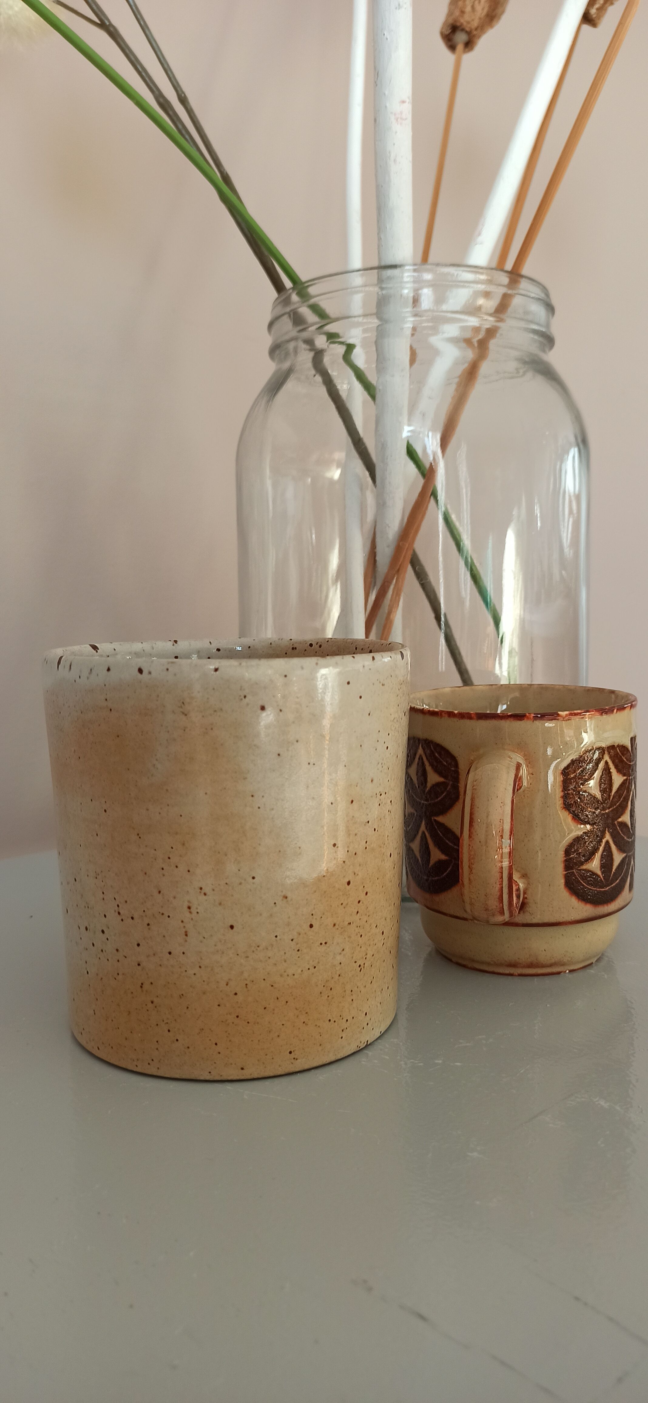 Coffee pot and mug cup in sandstone