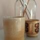 Coffee pot and mug cup in sandstone