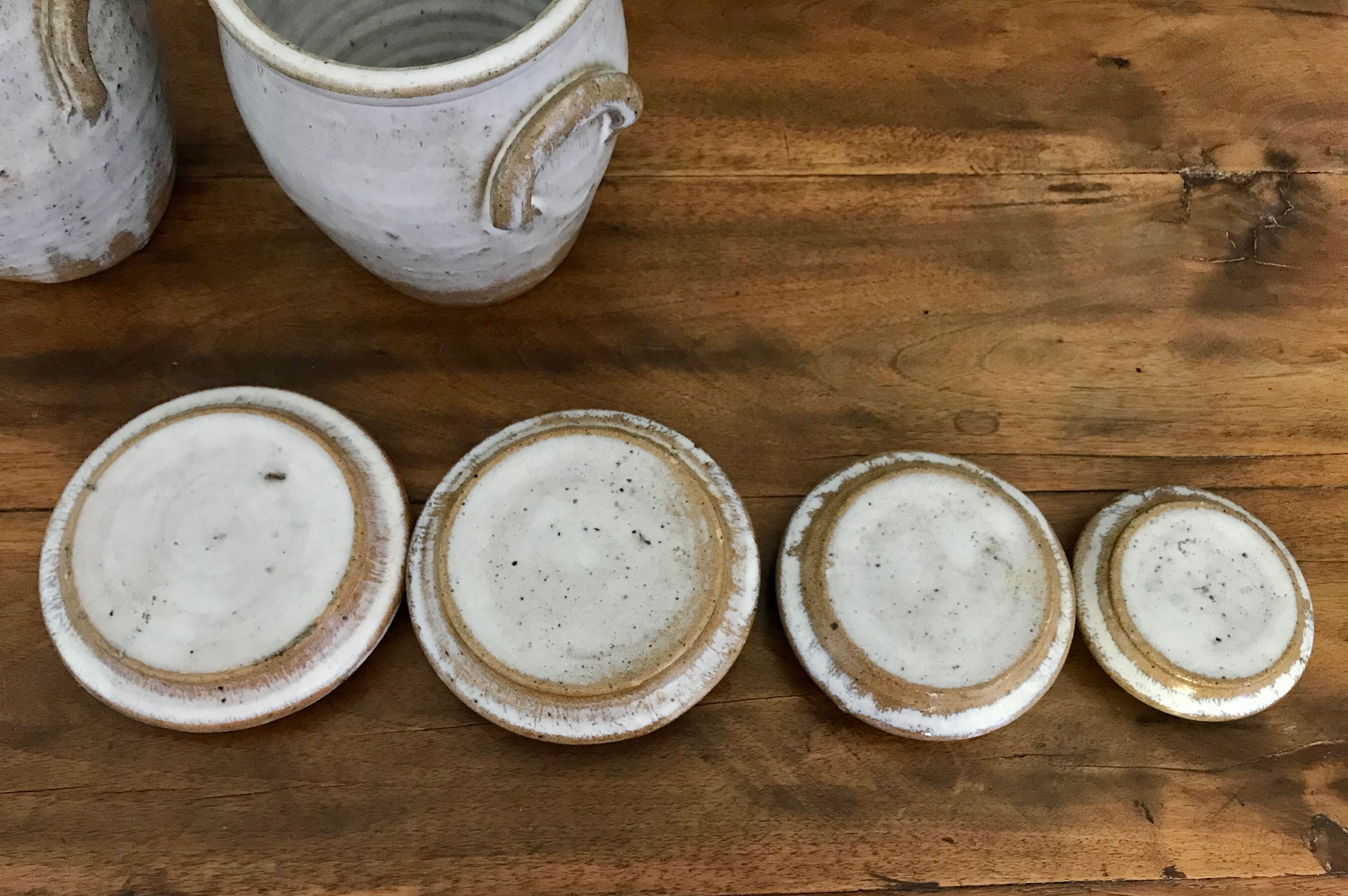 Suite of antique enamelled ceramic pots