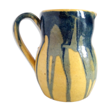 Yellow, blue and green rustic pitcher
